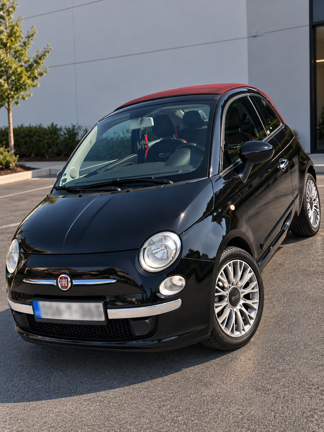 Fiat 500C front three-quarter view, black with red soft top