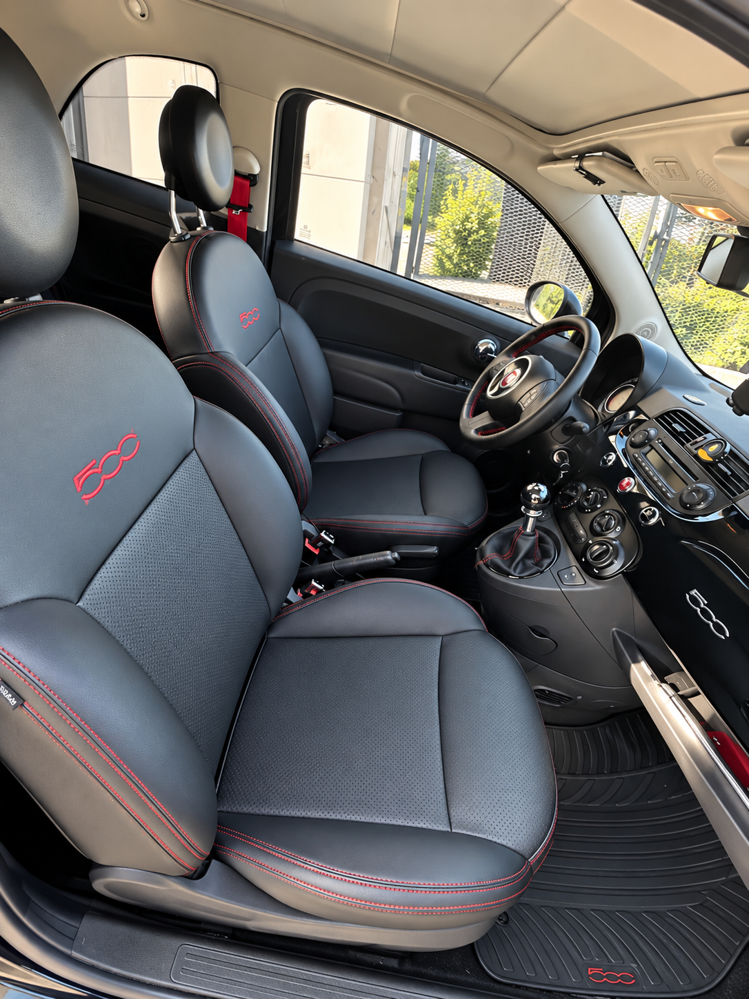 Fiat 500C interior, black leather seats with red stitching